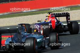 Daniil Kvyat (RUS) Red Bull Racing RB11 leads Lewis Hamilton (GBR) Mercedes AMG F1 W06. 03.07.2015. Formula 1 World Championship, Rd 9, British Grand Prix, Silverstone, England, Practice Day.