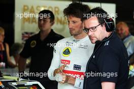Romain Grosjean (FRA) Lotus F1 Team with Julien Simon-Chautemps (FRA) Lotus F1 Team Race Engineer. 03.07.2015. Formula 1 World Championship, Rd 9, British Grand Prix, Silverstone, England, Practice Day.