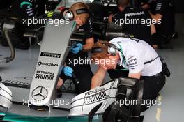 Mercedes AMG F1 W06 front wing worked on by mechanics. 03.07.2015. Formula 1 World Championship, Rd 9, British Grand Prix, Silverstone, England, Practice Day.