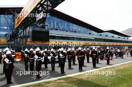 A band plays on the grid. 05.07.2015. Formula 1 World Championship, Rd 9, British Grand Prix, Silverstone, England, Race Day.