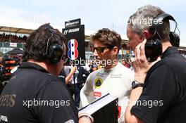 Romain Grosjean (FRA) Lotus F1 Team on the grid. 05.07.2015. Formula 1 World Championship, Rd 9, British Grand Prix, Silverstone, England, Race Day.