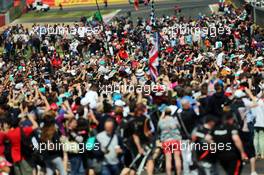 Fans invade the circuit at the end of the race. 05.07.2015. Formula 1 World Championship, Rd 9, British Grand Prix, Silverstone, England, Race Day.