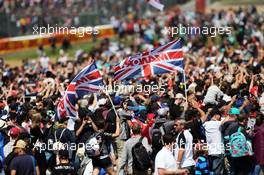 Fans invade the circuit at the end of the race. 05.07.2015. Formula 1 World Championship, Rd 9, British Grand Prix, Silverstone, England, Race Day.