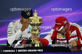 (L to R): Lewis Hamilton (GBR) Mercedes AMG F1 with Sebastian Vettel (GER) Ferrari in the FIA Press Conference. 05.07.2015. Formula 1 World Championship, Rd 9, British Grand Prix, Silverstone, England, Race Day.