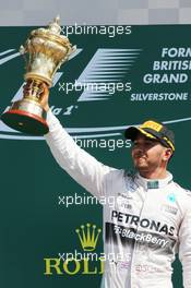 Race winner Lewis Hamilton (GBR) Mercedes AMG F1 celebrates on the podium. 05.07.2015. Formula 1 World Championship, Rd 9, British Grand Prix, Silverstone, England, Race Day.