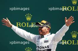 Race winner Lewis Hamilton (GBR) Mercedes AMG F1 celebrates on the podium. 05.07.2015. Formula 1 World Championship, Rd 9, British Grand Prix, Silverstone, England, Race Day.