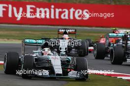 Lewis Hamilton (GBR) Mercedes AMG F1 W06 runs wide as he tries to pass Felipe Massa (BRA) Williams FW37 for the lead of the race. 05.07.2015. Formula 1 World Championship, Rd 9, British Grand Prix, Silverstone, England, Race Day.