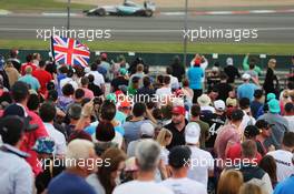 Lewis Hamilton (GBR) Mercedes AMG F1 W06 passes fans. 05.07.2015. Formula 1 World Championship, Rd 9, British Grand Prix, Silverstone, England, Race Day.