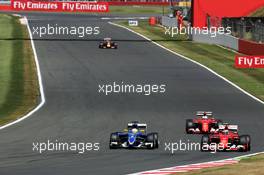 Marcus Ericsson (SWE) Sauber C34 and Kimi Raikkonen (FIN) Ferrari SF15-T battle for position. 05.07.2015. Formula 1 World Championship, Rd 9, British Grand Prix, Silverstone, England, Race Day.