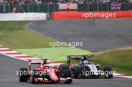 Kimi Raikkonen (FIN) Ferrari SF15-T and Sergio Perez (MEX) Sahara Force India F1 VJM08 battle for position. 05.07.2015. Formula 1 World Championship, Rd 9, British Grand Prix, Silverstone, England, Race Day.
