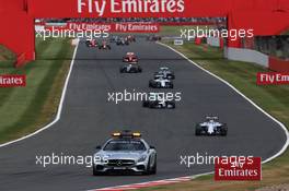 Felipe Massa (BRA) Williams FW37 leads behind the FIA Safety Car. 05.07.2015. Formula 1 World Championship, Rd 9, British Grand Prix, Silverstone, England, Race Day.