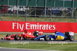 Kimi Raikkonen (FIN) Ferrari SF15-T and Marcus Ericsson (SWE) Sauber C34. 05.07.2015. Formula 1 World Championship, Rd 9, British Grand Prix, Silverstone, England, Race Day.