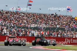 Sergio Perez (MEX) Sahara Force India F1 VJM08 leads Sebastian Vettel (GER) Ferrari SF15-T. 05.07.2015. Formula 1 World Championship, Rd 9, British Grand Prix, Silverstone, England, Race Day.