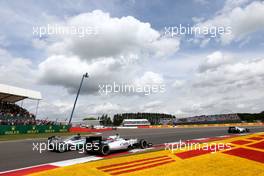 Start of the race, Lewis Hamilton (GBR), Mercedes AMG F1 Team and Valtteri Bottas (FIN), Williams F1 Team  05.07.2015. Formula 1 World Championship, Rd 9, British Grand Prix, Silverstone, England, Race Day.