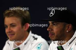 (L to R): Nico Rosberg (GER) Mercedes AMG F1 with team mate Lewis Hamilton (GBR) Mercedes AMG F1 in the FIA Press Conference. 04.07.2015. Formula 1 World Championship, Rd 9, British Grand Prix, Silverstone, England, Qualifying Day.