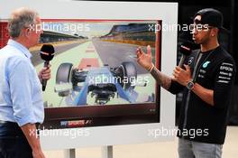 (L to R): Martin Brundle (GBR) Sky Sports Commentator with Lewis Hamilton (GBR) Mercedes AMG F1. 04.07.2015. Formula 1 World Championship, Rd 9, British Grand Prix, Silverstone, England, Qualifying Day.