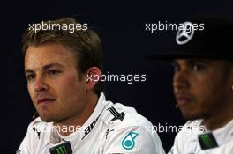 (L to R): Nico Rosberg (GER) Mercedes AMG F1 with team mate Lewis Hamilton (GBR) Mercedes AMG F1 in the FIA Press Conference. 04.07.2015. Formula 1 World Championship, Rd 9, British Grand Prix, Silverstone, England, Qualifying Day.