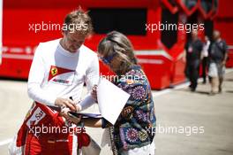 Sebastian Vettel (GER) Ferrari signs autographs for the fans. 04.07.2015. Formula 1 World Championship, Rd 9, British Grand Prix, Silverstone, England, Qualifying Day.