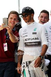 Lewis Hamilton (GBR) Mercedes AMG F1 with fans. 04.07.2015. Formula 1 World Championship, Rd 9, British Grand Prix, Silverstone, England, Qualifying Day.