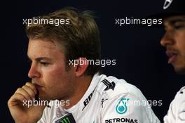 (L to R): Nico Rosberg (GER) Mercedes AMG F1 with team mate Lewis Hamilton (GBR) Mercedes AMG F1 in the FIA Press Conference. 04.07.2015. Formula 1 World Championship, Rd 9, British Grand Prix, Silverstone, England, Qualifying Day.