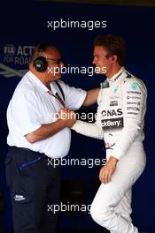 Nico Rosberg (GER) Mercedes AMG F1 celebrates his second position in qualifying parc ferme with Pat Behar (FRA) FIA. 04.07.2015. Formula 1 World Championship, Rd 9, British Grand Prix, Silverstone, England, Qualifying Day.