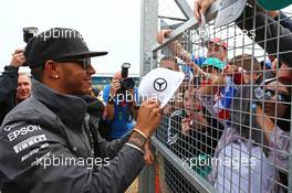 Lewis Hamilton (GBR) Mercedes AMG F1 with the fans. 05.07.2015. Formula 1 World Championship, Rd 9, British Grand Prix, Silverstone, England, Race Day.