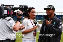 Lewis Hamilton (GBR) Mercedes AMG F1 with Natalie Pinkham (GBR) Sky Sports Presenter. 05.07.2015. Formula 1 World Championship, Rd 9, British Grand Prix, Silverstone, England, Race Day.