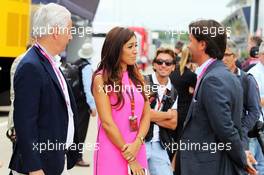 (L to R): Ali Malek QC, with Fabiana Flosi (BRA), wife of Bernie Ecclestone (GBR). 05.07.2015. Formula 1 World Championship, Rd 9, British Grand Prix, Silverstone, England, Race Day.