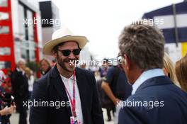 (L to R): Will Young (GBR) Singer with Eddie Jordan (IRE) BBC Television Pundit. 05.07.2015. Formula 1 World Championship, Rd 9, British Grand Prix, Silverstone, England, Race Day.