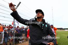 Lewis Hamilton (GBR) Mercedes AMG F1 with the fans. 05.07.2015. Formula 1 World Championship, Rd 9, British Grand Prix, Silverstone, England, Race Day.