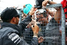 Lewis Hamilton (GBR) Mercedes AMG F1 with the fans. 05.07.2015. Formula 1 World Championship, Rd 9, British Grand Prix, Silverstone, England, Race Day.