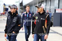 (L to R): Sergio Perez (MEX) Sahara Force India F1 with Pastor Maldonado (VEN) Lotus F1 Team. 05.07.2015. Formula 1 World Championship, Rd 9, British Grand Prix, Silverstone, England, Race Day.