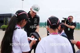 Nico Hulkenberg (GER) Sahara Force India F1 signs autographs for F1 in Schools Children. 02.07.2015. Formula 1 World Championship, Rd 9, British Grand Prix, Silverstone, England, Preparation Day.
