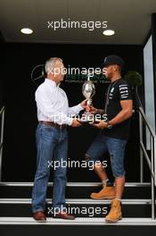 Lewis Hamilton (GBR) Mercedes AMG F1 receives the Hawthorn Memorial Trophy from Rob Jones (GBR) Motor Sports Association (MSA) Chief Executive. 02.07.2015. Formula 1 World Championship, Rd 9, British Grand Prix, Silverstone, England, Preparation Day.