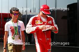 Kimi Raikkonen (FIN) Ferrari signs autographs for the fans. 24.07.2015. Formula 1 World Championship, Rd 10, Hungarian Grand Prix, Budapest, Hungary, Practice Day.