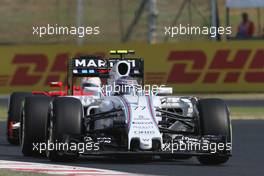 Valtteri Bottas (FIN) Williams FW37 leads Sebastian Vettel (GER) Ferrari SF15-T. 24.07.2015. Formula 1 World Championship, Rd 10, Hungarian Grand Prix, Budapest, Hungary, Practice Day.