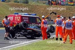 Marshals recover the Sahara Force India F1 VJM08 of Sergio Perez (MEX) after he crashed in the first practice session. 24.07.2015. Formula 1 World Championship, Rd 10, Hungarian Grand Prix, Budapest, Hungary, Practice Day.