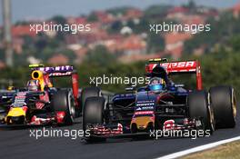 Carlos Sainz Jr (ESP) Scuderia Toro Rosso STR10 and Daniil Kvyat (RUS) Red Bull Racing RB11. 24.07.2015. Formula 1 World Championship, Rd 10, Hungarian Grand Prix, Budapest, Hungary, Practice Day.