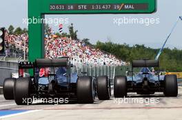 Nico Rosberg (GER) Mercedes AMG F1 W06 and Lewis Hamilton (GBR) Mercedes AMG F1 W06 at the end of the pit lane. 24.07.2015. Formula 1 World Championship, Rd 10, Hungarian Grand Prix, Budapest, Hungary, Practice Day.
