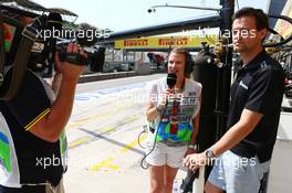 (L to R): Jennie Gow (GBR) BBC Radio 5 Live Pitlane Reporter with Jolyon Palmer (GBR) Lotus F1 Team Test and Reserve Driver. 24.07.2015. Formula 1 World Championship, Rd 10, Hungarian Grand Prix, Budapest, Hungary, Practice Day.