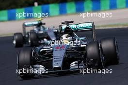 Lewis Hamilton (GBR) Mercedes AMG F1 W06 leads team mate Nico Rosberg (GER) Mercedes AMG F1 W06. 24.07.2015. Formula 1 World Championship, Rd 10, Hungarian Grand Prix, Budapest, Hungary, Practice Day.