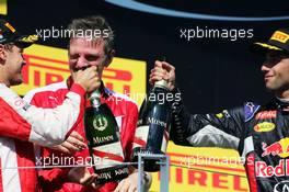 (L to R): Race winner Sebastian Vettel (GER) Ferrari and James Allison (GBR) Ferrari Chassis Technical Director celebrate on the podium with Daniel Ricciardo (AUS) Red Bull Racing. 26.07.2015. Formula 1 World Championship, Rd 10, Hungarian Grand Prix, Budapest, Hungary, Race Day.