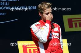 Race winner Sebastian Vettel (GER) Ferrari celebrates on the podium. 26.07.2015. Formula 1 World Championship, Rd 10, Hungarian Grand Prix, Budapest, Hungary, Race Day.