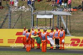 Marshals observe the pre-race tribute to Jules Bianchi. 26.07.2015. Formula 1 World Championship, Rd 10, Hungarian Grand Prix, Budapest, Hungary, Race Day.