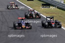 Carlos Sainz (ESP), Scuderia Toro Rosso and jJenson Button (GBR), McLaren Honda  26.07.2015. Formula 1 World Championship, Rd 10, Hungarian Grand Prix, Budapest, Hungary, Race Day.