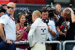 Valtteri Bottas (FIN) Williams with Jennie Gow (GBR) BBC Radio 5 Live Pitlane Reporter. 25.07.2015. Formula 1 World Championship, Rd 10, Hungarian Grand Prix, Budapest, Hungary, Qualifying Day.