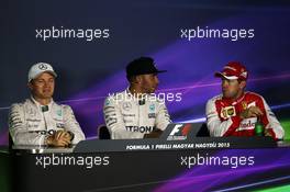 Qualifying top three in the FIA Press Conference (L to R): Nico Rosberg (GER) Mercedes AMG F1, second; Lewis Hamilton (GBR) Mercedes AMG F1, pole position; Sebastian Vettel (GER) Ferrari, third. 25.07.2015. Formula 1 World Championship, Rd 10, Hungarian Grand Prix, Budapest, Hungary, Qualifying Day.