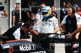 The McLaren MP4-30 of Fernando Alonso (ESP) McLaren is pushed into the pits during qualifying. 25.07.2015. Formula 1 World Championship, Rd 10, Hungarian Grand Prix, Budapest, Hungary, Qualifying Day.