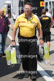 A Renault F1 Sport employee brings extra fans into the paddock. 23.07.2015. Formula 1 World Championship, Rd 10, Hungarian Grand Prix, Budapest, Hungary, Preparation Day.