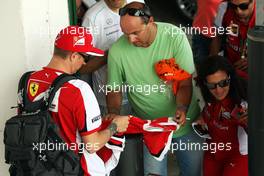 Kimi Raikkonen (FIN) Ferrari signs autographs for the fans. 23.07.2015. Formula 1 World Championship, Rd 10, Hungarian Grand Prix, Budapest, Hungary, Preparation Day.